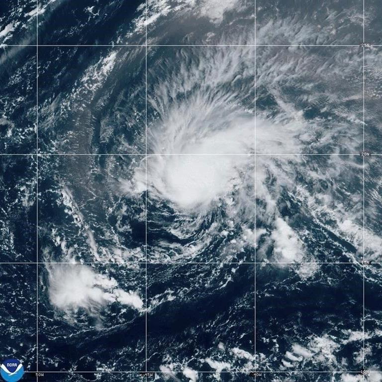 Hurricane Isaac and Tropical Storm Joyce move through the open Atlantic far from land